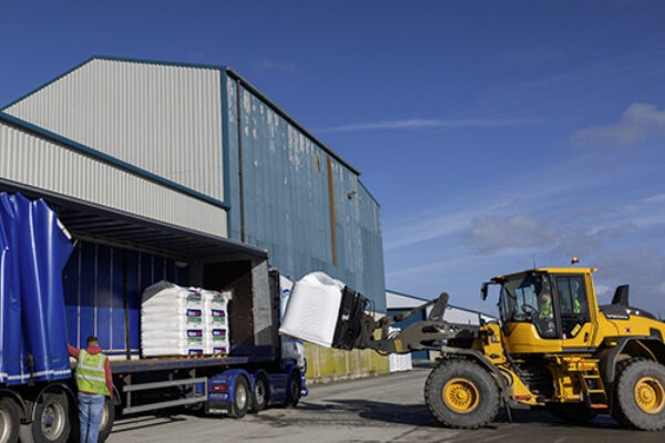 NitroFert staff loading a truck with large bags of fertiliser