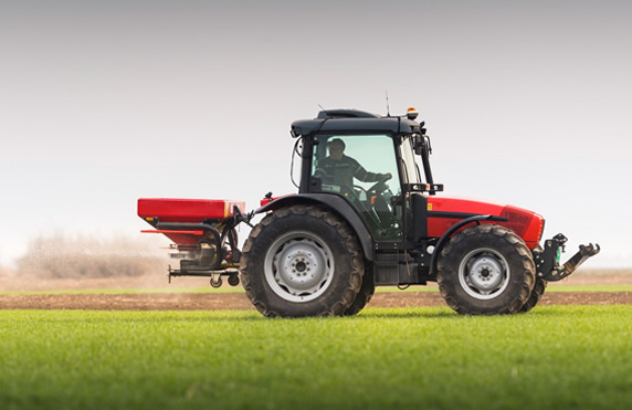 Tractor spreading fertiliser - Nitrofert